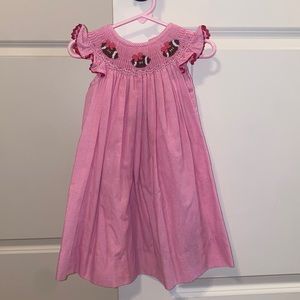 Pink smocked football dress